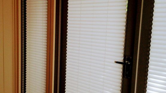 Pleated blinds fitted on a customers door